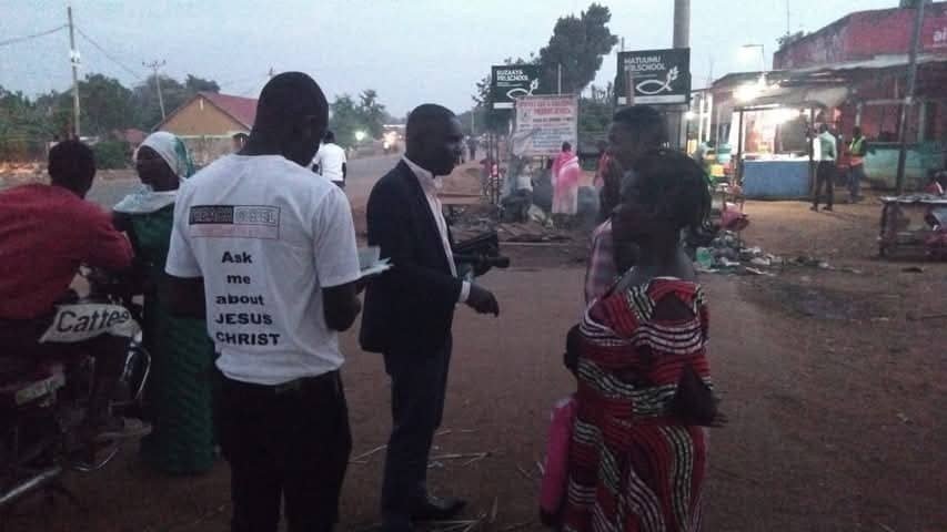 Street evangelism in Buwenge Town Council at dusk
